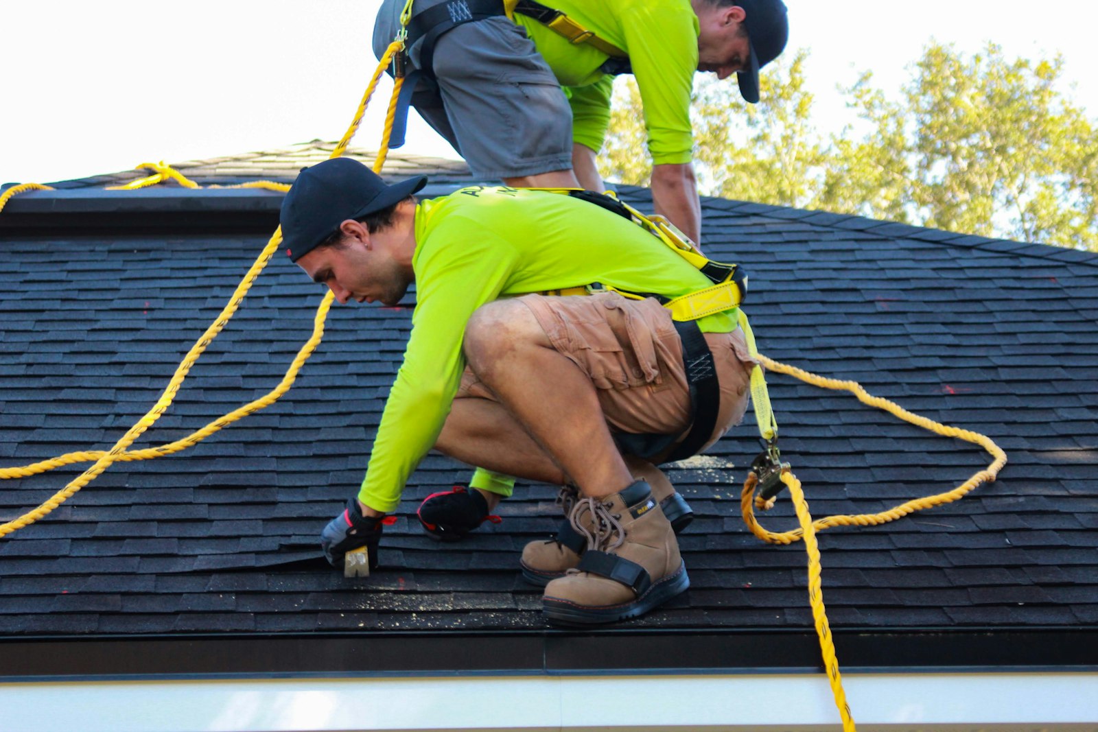 Quik Roofers crew working on a residential roof